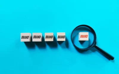 Magnifying glass highlighting one of five "Brand" blocks on blue background.